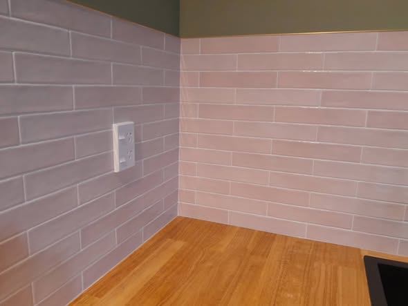 Lavender handmade brick splashback in corner